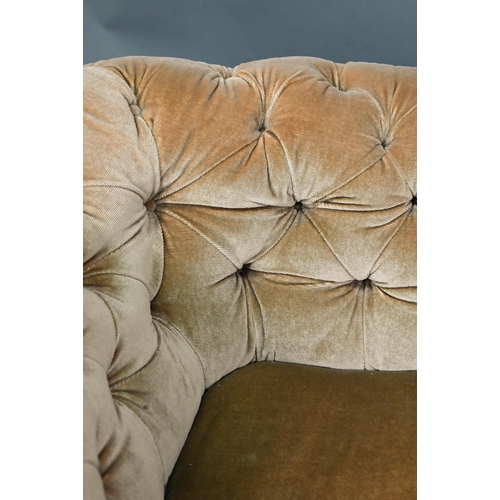 998 - A Victorian button upholstered sofa, raised on moulded and turned walnut front lets, on ceramic cast... 