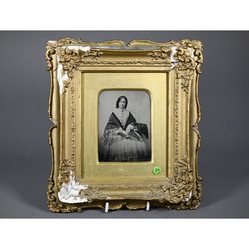 1136 - A 19th century Ambrotype photograph of a young lady, in gilt frame