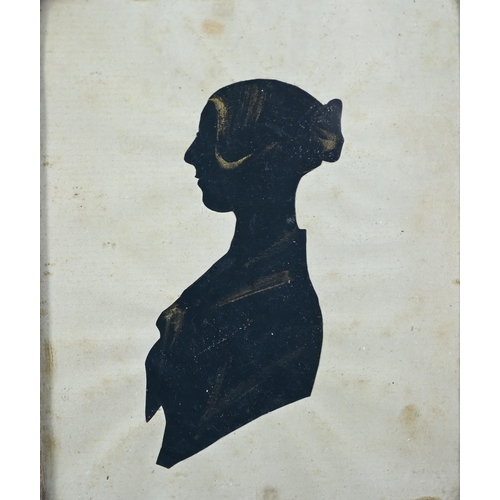 1138 - An antique ink and wash silhouette portrait of a lady in extravagant lace cap and collar, dated 1783... 