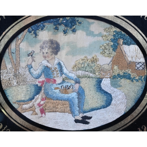 1142 - A pair of 19th century oval silk longstitch pictures of a young girl and a boy with birds in garden ... 