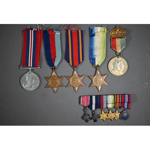 1160 - A Royal Navy miniature GRVI Distinguished Service Cross medal group comprising an MBE, DSC, 1939-45 ... 