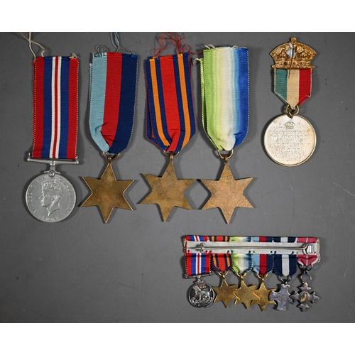 1160 - A Royal Navy miniature GRVI Distinguished Service Cross medal group comprising an MBE, DSC, 1939-45 ... 