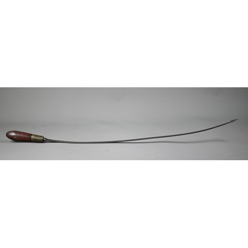 1283 - An antique weapon, the 60 cm curved steel blade with barbed finial, on brass-mounted rosewood hilt, ... 