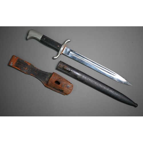 1309 - An Eickhorn single fuller steel blade knife with bakelite grips on steel handle, in steel scabbard a... 