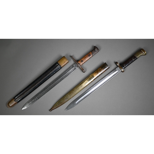 1308 - An E26 bayonet, the sngle fuller blade with wood grip, in steel scabbard to/w another bayonet and sc... 