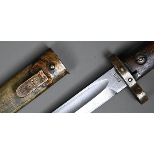 1308 - An E26 bayonet, the sngle fuller blade with wood grip, in steel scabbard to/w another bayonet and sc... 