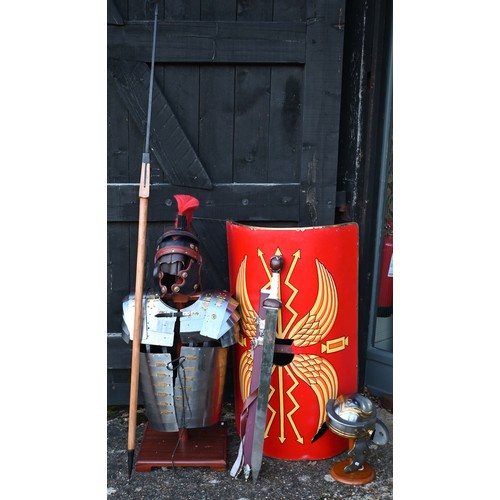 1291 - Reproduction Roman armour - a segmented steel breast/shoulder tunic, on wooden stand to/with a shiel... 