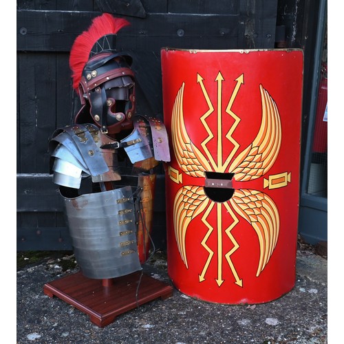 1291 - Reproduction Roman armour - a segmented steel breast/shoulder tunic, on wooden stand to/with a shiel... 