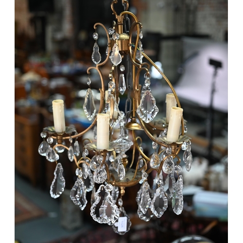 1026 - A gilt brass and crystal glass hung five branch electrolier, approx. 40 cm dia. x 60 cm h