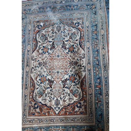 1067 - An old Persian Tabriz rug, camel ground, 168 cm x 114 cm