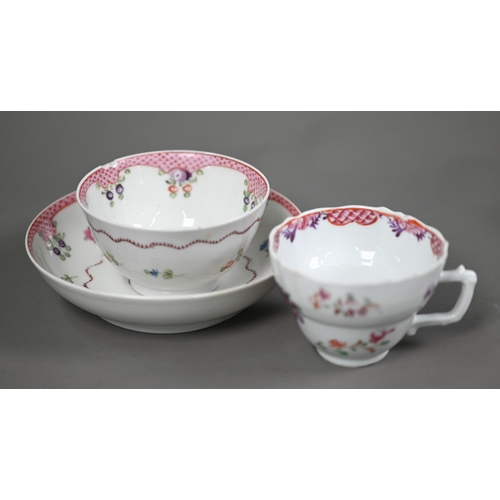 650A - A New Hall tea bowl and saucer with floral and pink scale decoration, to/w a similar coffee cup and ... 