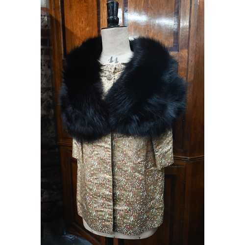 1285 - A vintage black fur shoulder cape to/w a gold brocade jacket featuring small floral sprigs, with man... 