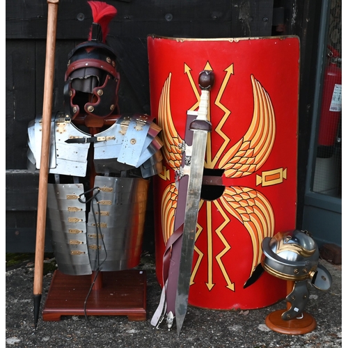 1291 - Reproduction Roman armour - a segmented steel breast/shoulder tunic, on wooden stand to/with a shiel... 