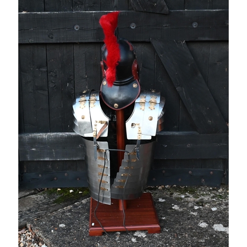 1291 - Reproduction Roman armour - a segmented steel breast/shoulder tunic, on wooden stand to/with a shiel... 