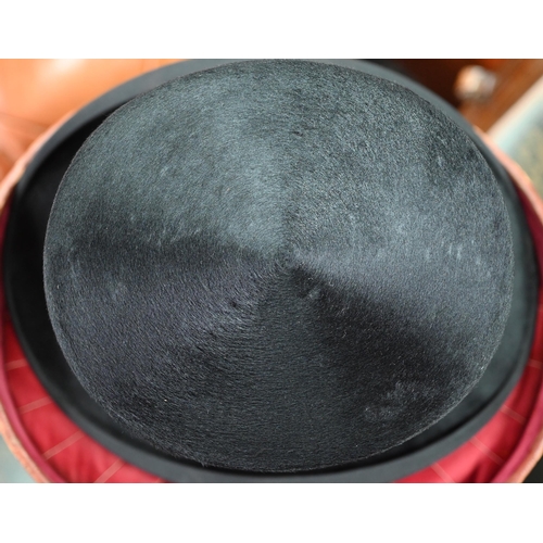 1284 - A vintage black silk top hat by Morgan of Dublin in fitted leather hatbox by R Erskine to/w a grey f... 