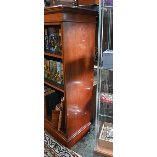 900 - A Victorian mahogany low open bookcase, centred by two long drawers over an open niche and pair cupb... 