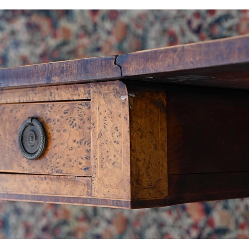 978 - A Regency cross-banded burr walnut sofa table, with two frieze drawers opposing dummy drawer fronts,... 