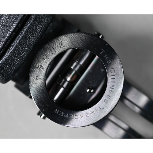 259 - The Chinese Timekeeper - the black finished 44 mm dia. stainless steel case with conforming black di... 