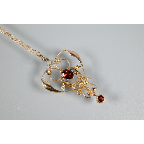 448 - A Victorian 9ct gold garnet and seed pearl open pendant, on fine trace chain, approx 3.9g all in