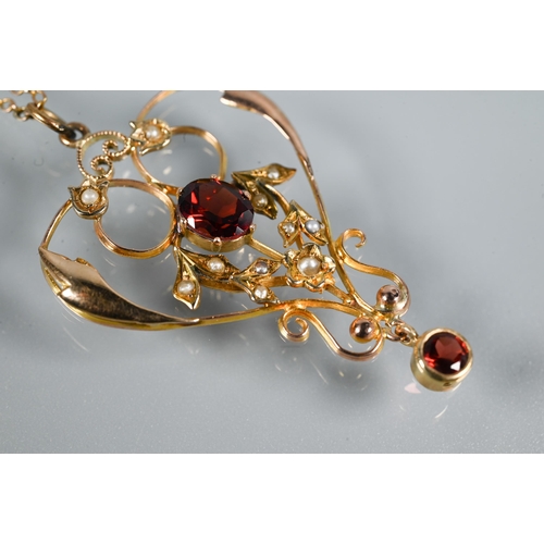 448 - A Victorian 9ct gold garnet and seed pearl open pendant, on fine trace chain, approx 3.9g all in