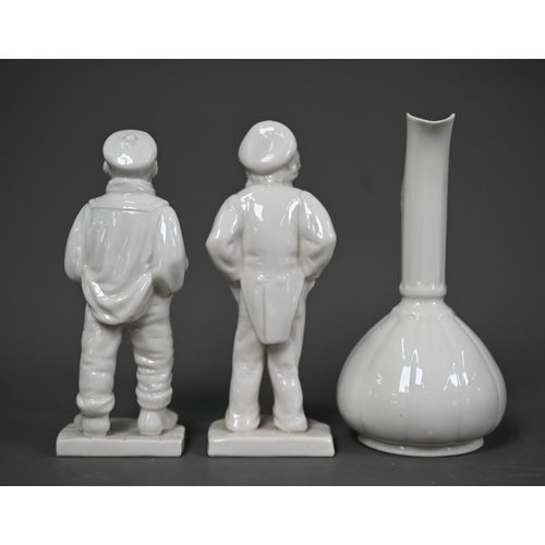 637 - A pair of Victorian Royal Worcester white glazed china figures of a sailor and a street-urchin, thei... 