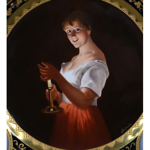 663 - A Vienna porcelain cabinet plate, painted with 'Girl with a Candle' after Georges de la Tour, signed... 