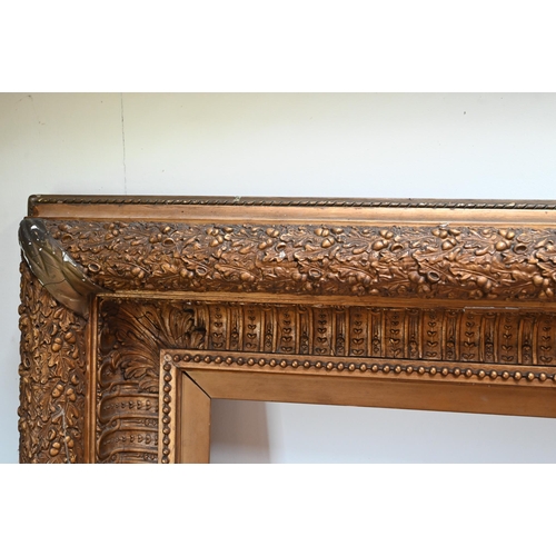 859 - A large decorative 19th century picture frame with well-detailed mouldings depicting oak leaves and ... 