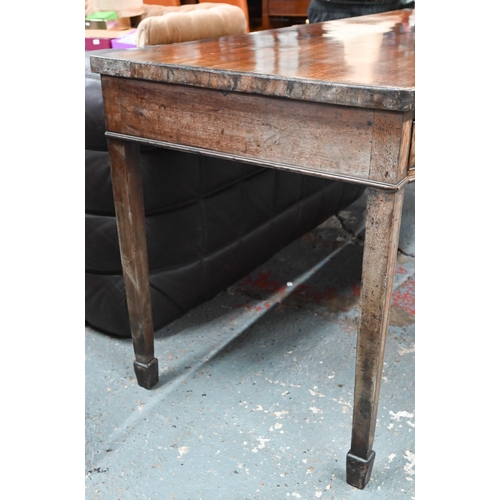 935 - A Victorian mahogany bow-fronted sideboard with three drawers, raised on square tapering legs to spa... 