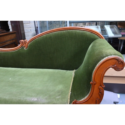 954 - A late Victorian walnut framed single scroll end chaise, upholstered in green dralon, raised on turn... 