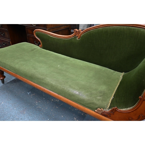 954 - A late Victorian walnut framed single scroll end chaise, upholstered in green dralon, raised on turn... 