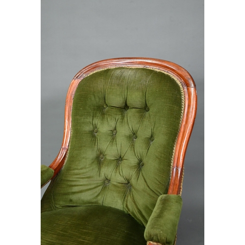 955 - Two Victorian button backed salon armchairs, in green dralon with serpentine seats, raised on turned... 