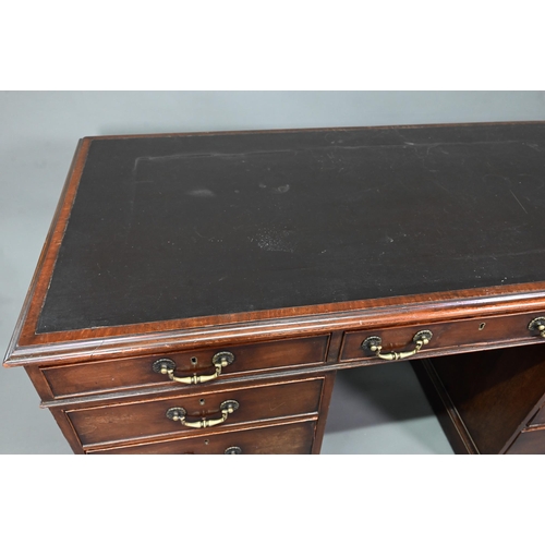 956 - An antique mahogany twin pedestal desk, the leathercloth inset top over an arrangement of nine drawe... 