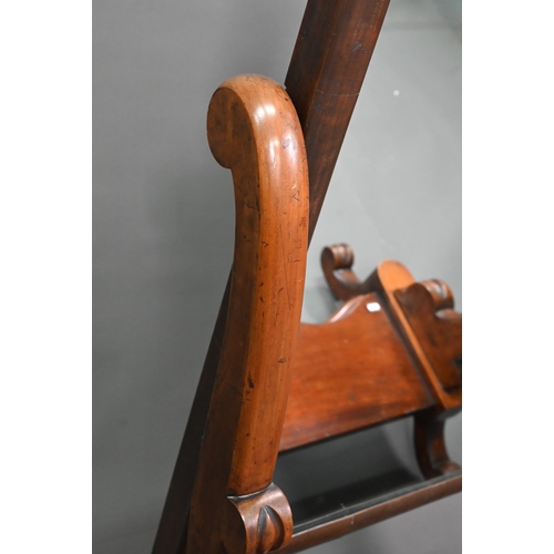 960 - A Victorian mahogany cheval mirror, the arched mirror plate raised above a platform base, on moulded... 