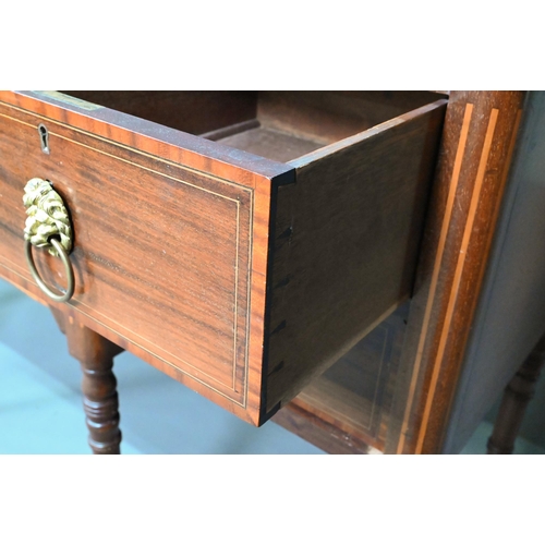 985 - A late 19th century Sheraton design mahogany breakfront sideboard, with an arrangement of six drawer... 