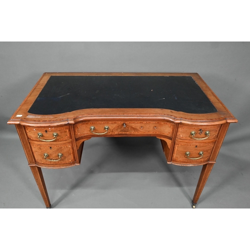 994 - A late 19th century cross-banded satinwood desk, the top with leather surface over five drawers, rai... 