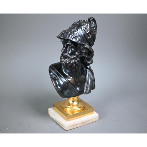 1083 - An antique classical bronze bust, raised on a gilt socle on onyx base, 27 cm h