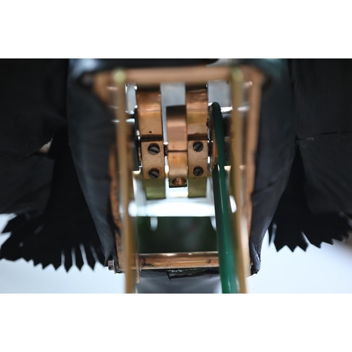 1250 - A brass, copper and leather 'Flying Mascot' automaton crow, probably designed as a shop window displ... 