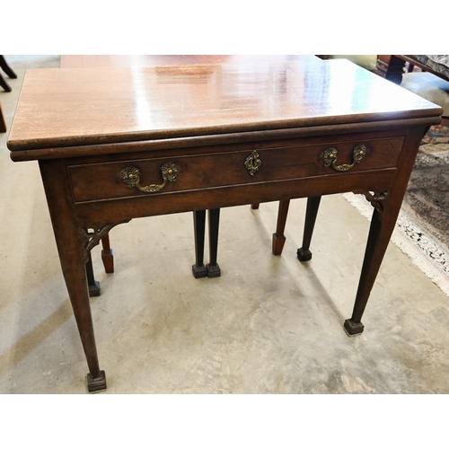A III mahogany folding tea table with frieze drawer and tapering