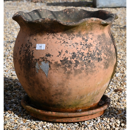 55 - A weathered terracotta planter (40 cm high x 42 cm diameter) and circular tray (2)