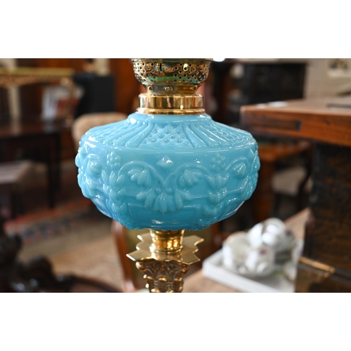 535 - A Victorian brass oil lamp with etched globe shade, blue pressed glass font and classical pillar, 72... 