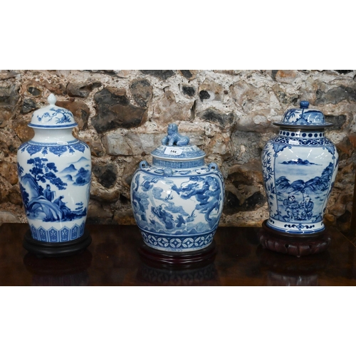 A Chinese porcelain baluster vase and cover with blue and white printed decoration, 30 cm high on carved wood stand, to/w a bulbous jar and cover with blue and white painted decoration and a German porcelain vase and cover, decorated in the chinoiserie manner (3)