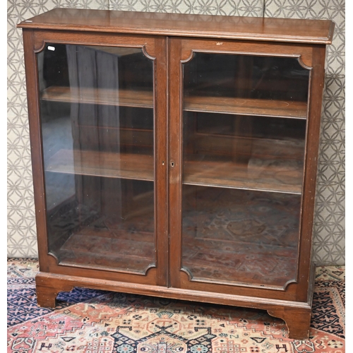 521 - A mahogany glazed display cabinet with two doors enclosing adjustable shelves, 108 cm w x 35 cm d x ... 