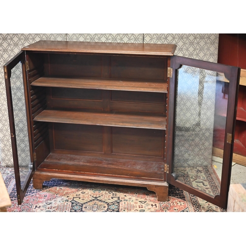 521 - A mahogany glazed display cabinet with two doors enclosing adjustable shelves, 108 cm w x 35 cm d x ... 