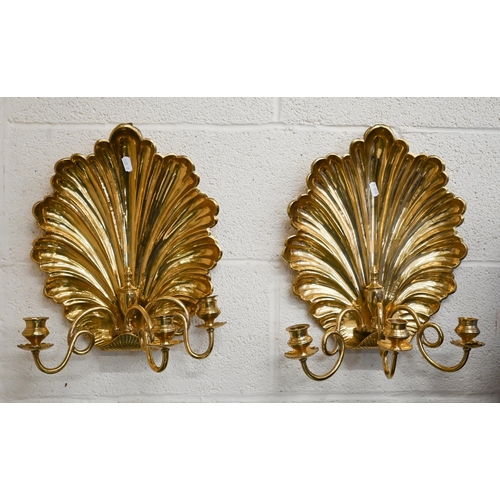 536 - A pair of three-branch brass 'shell' wall sconces