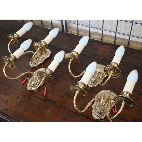 537 - Four brass twin-branch wall sconces with beaded wall plates