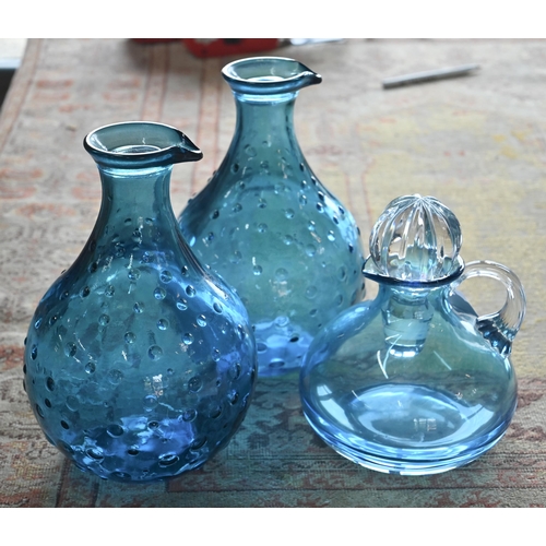 A Nina Campbell blue glass jug to/w two moulded blue glass carafes (3)