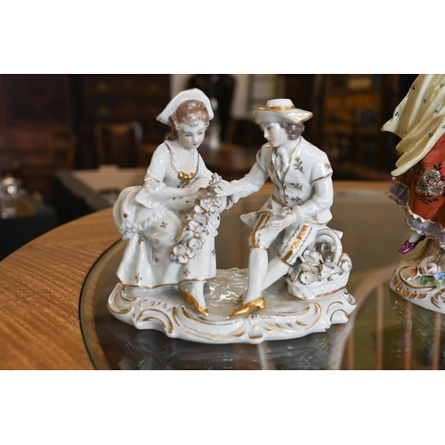 70 - A pair of Sitzendorf porcelain figures of an 18th century lady and gentleman, 17/14cm high, to/w a s... 