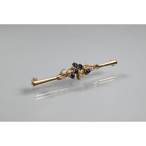 215 - A 9ct yellow gold bar brooch set with sapphires and diamonds in leaf tendril setting, 5 cm long, app... 