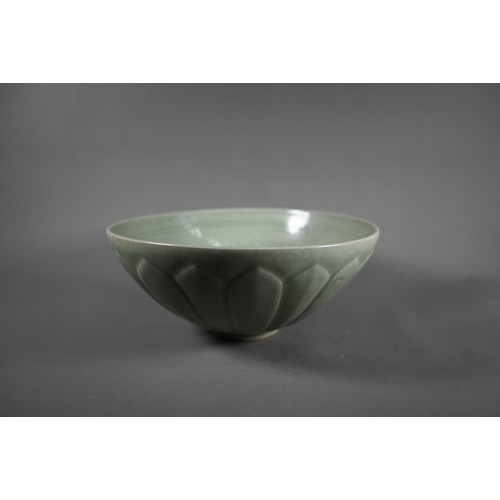 456 - A Chinese Song style celadon lotus bowl, evenly covered with an opaque sage green glaze, the interio... 