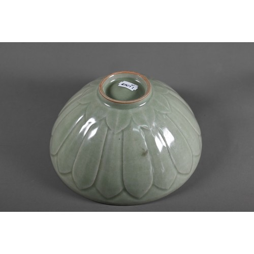 456 - A Chinese Song style celadon lotus bowl, evenly covered with an opaque sage green glaze, the interio... 